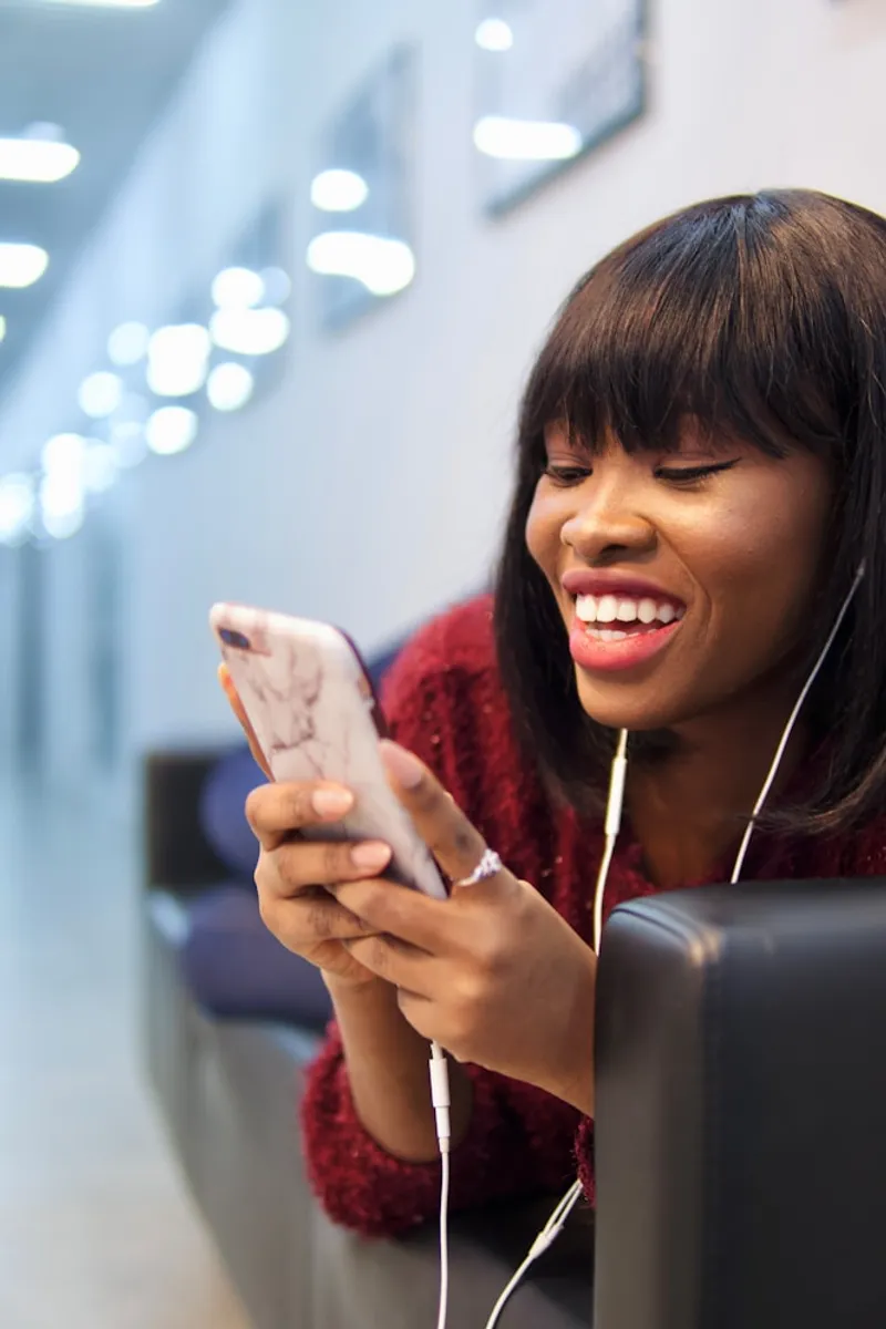 Happy woman using mobile phone for loan application